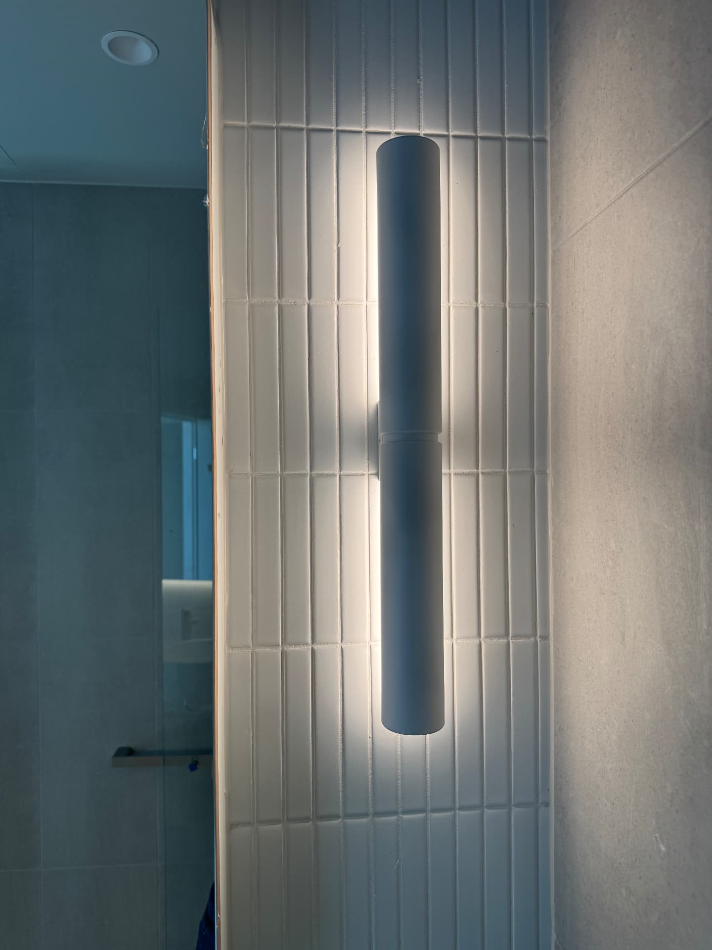 Bathroom feature tiles with sealed wall light junction