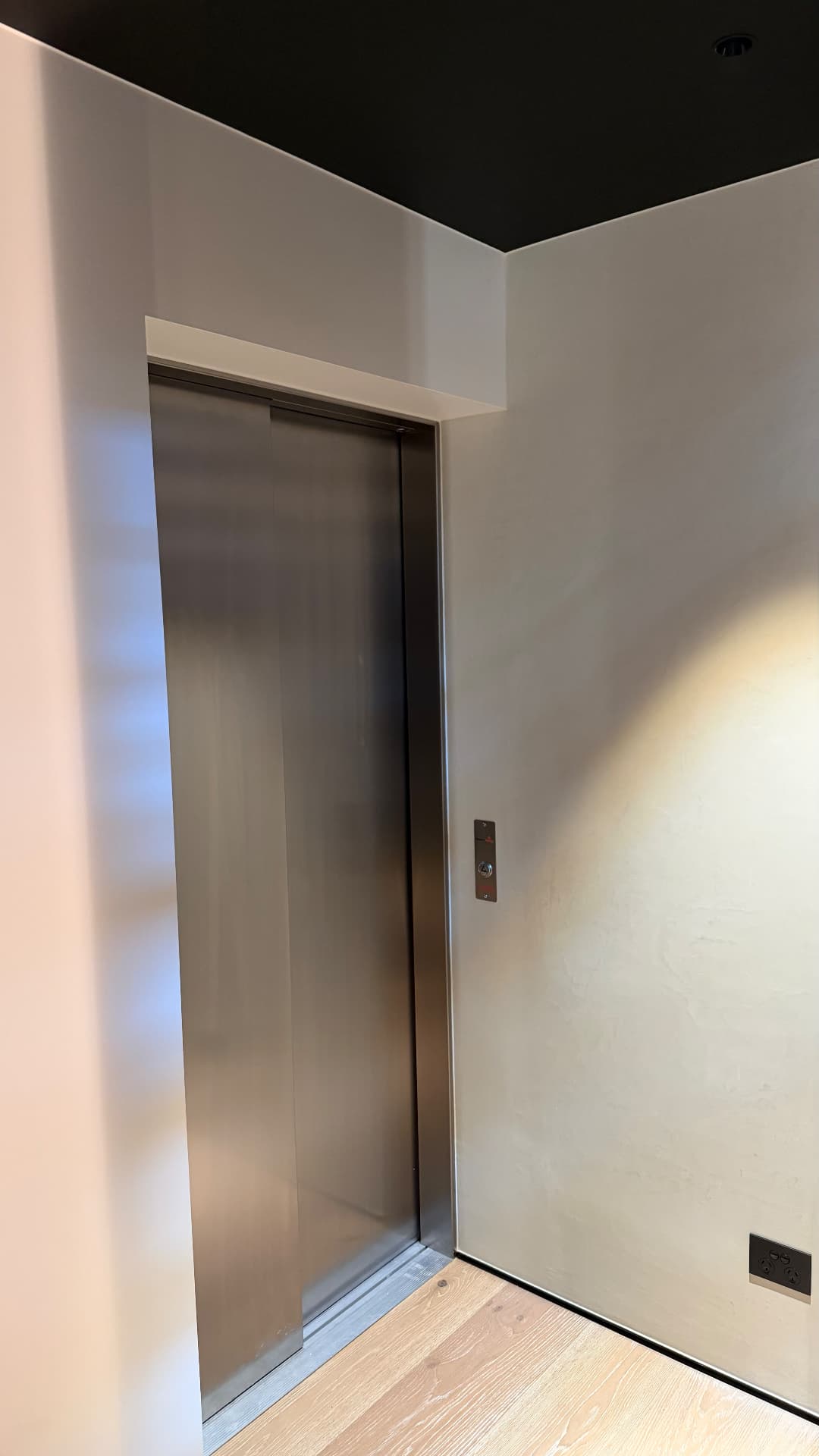 Sealed lift door frame and wall junction