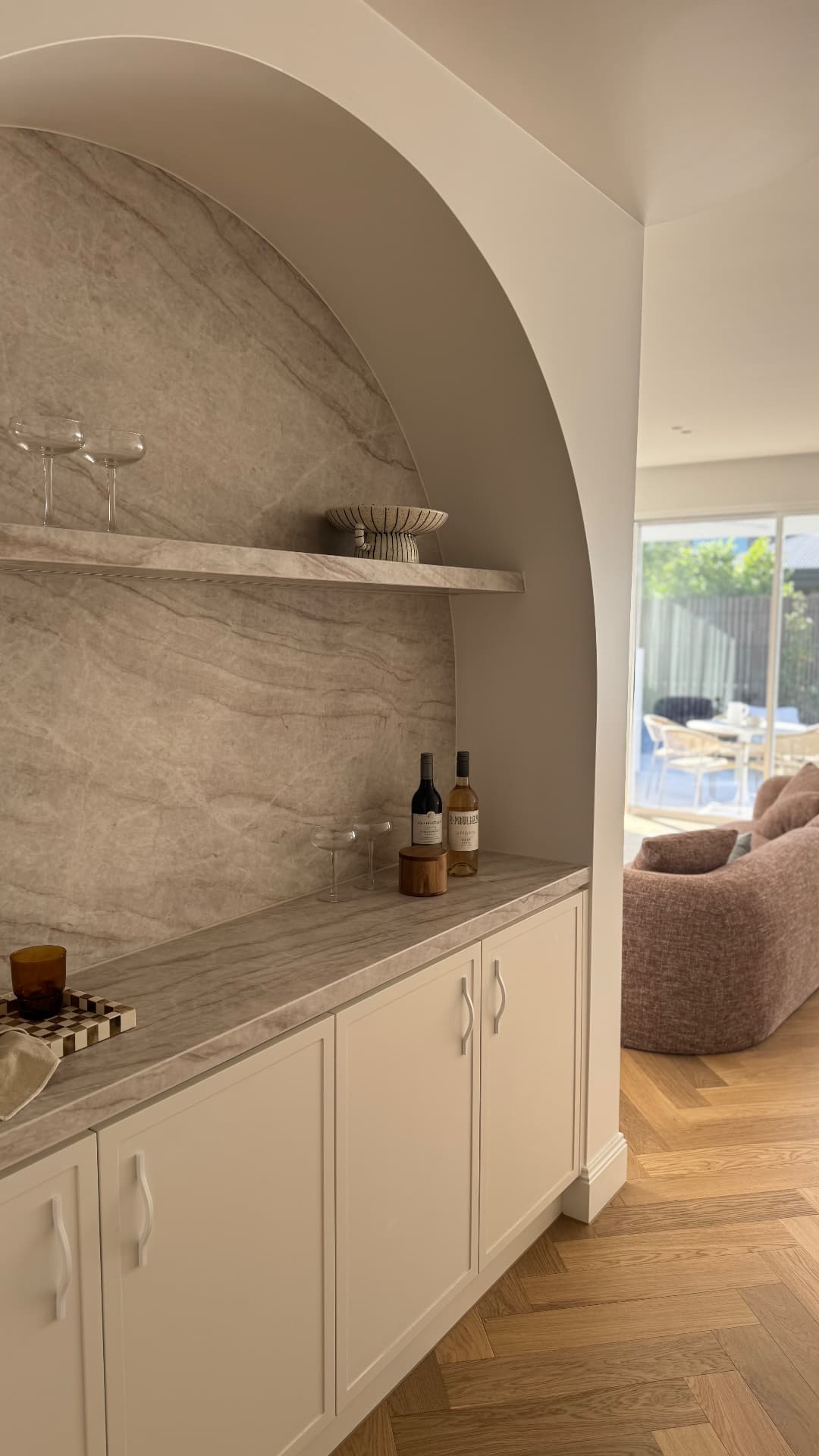 Arched bar nook with sealed stone shelf, benchtop and cabinetry