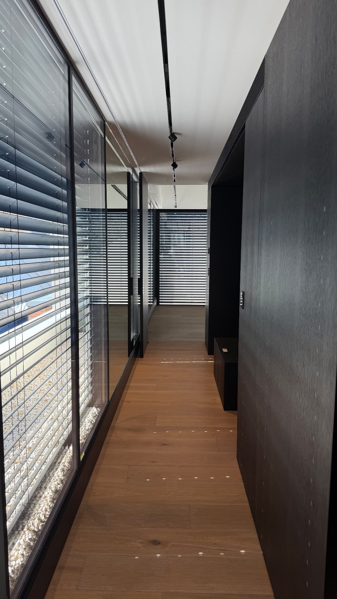 Hallway with sealed glazing, joinery and timber floor junctions