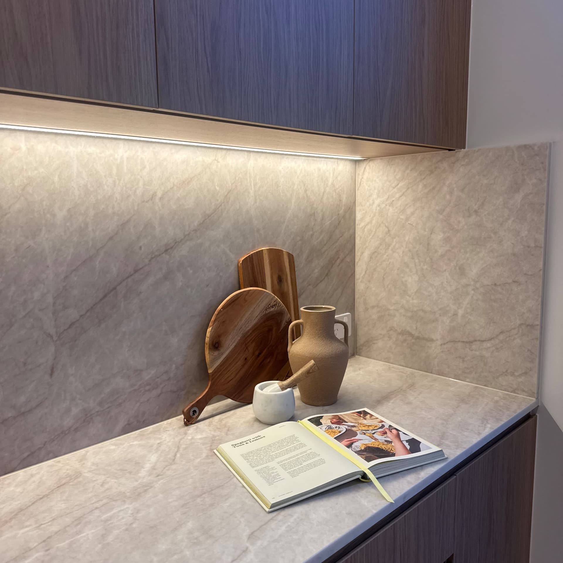 Butler's pantry with sealed stone benchtop and splashback corner