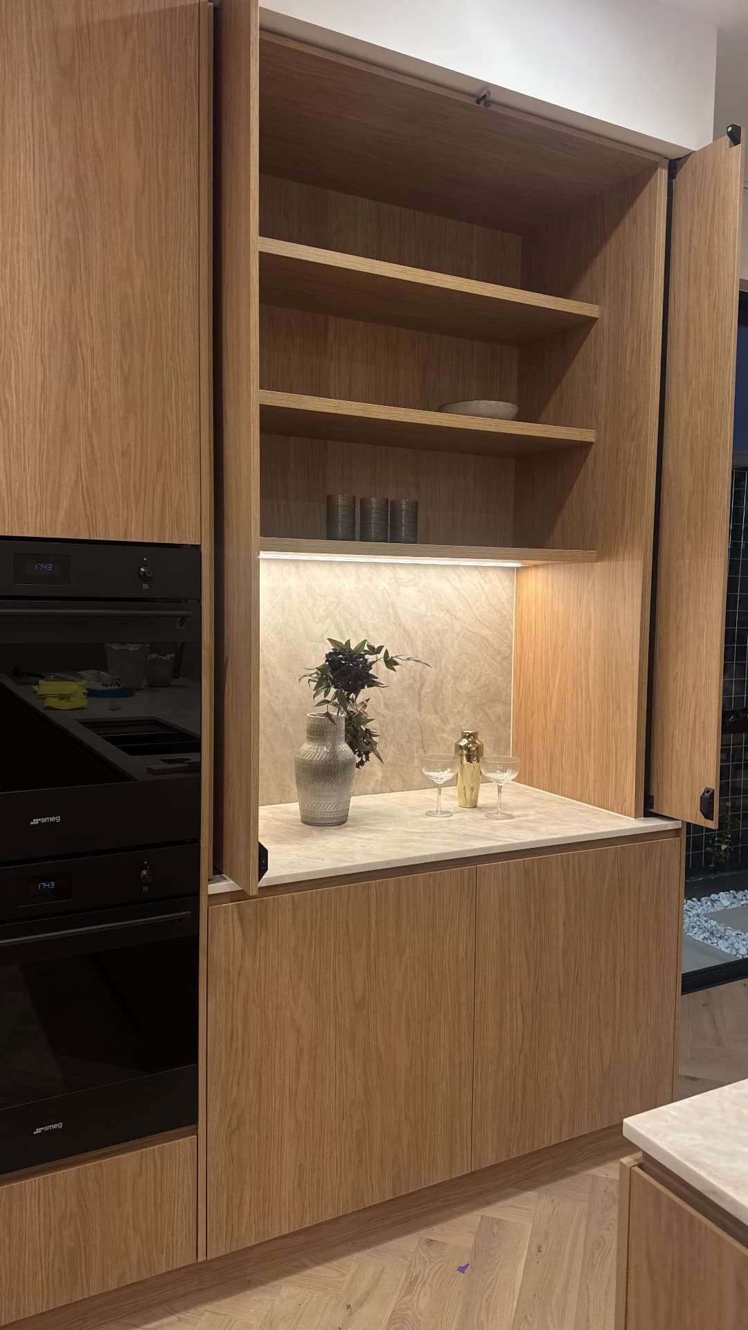 Appliance cabinet with sealed stone benchtop and timber joinery joints