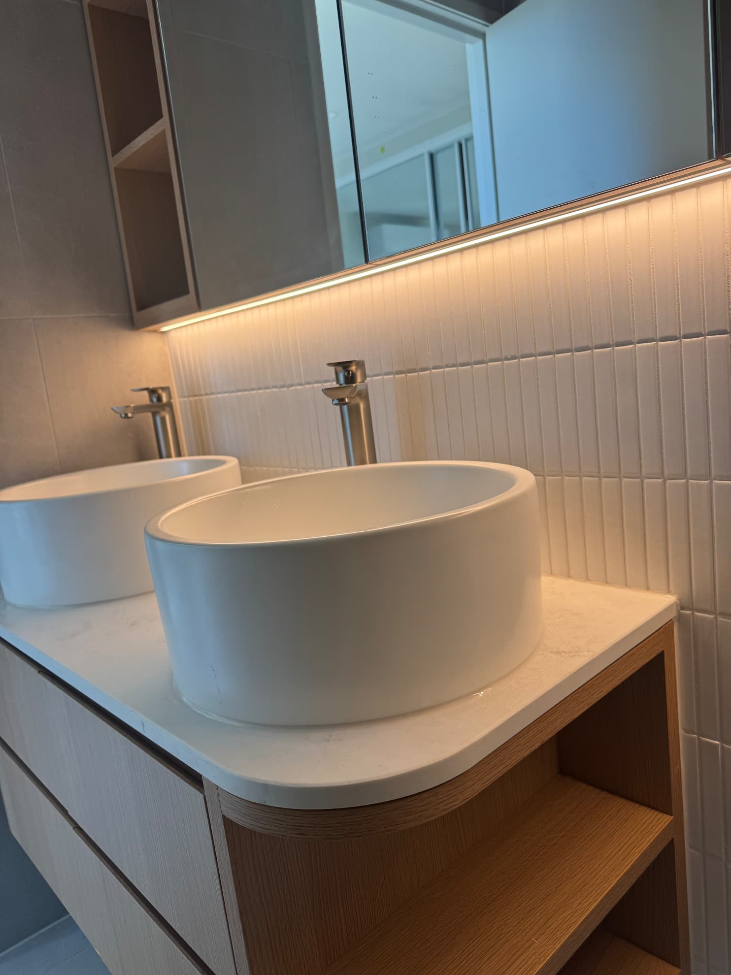 Twin vessel basins on sealed stone vanity top