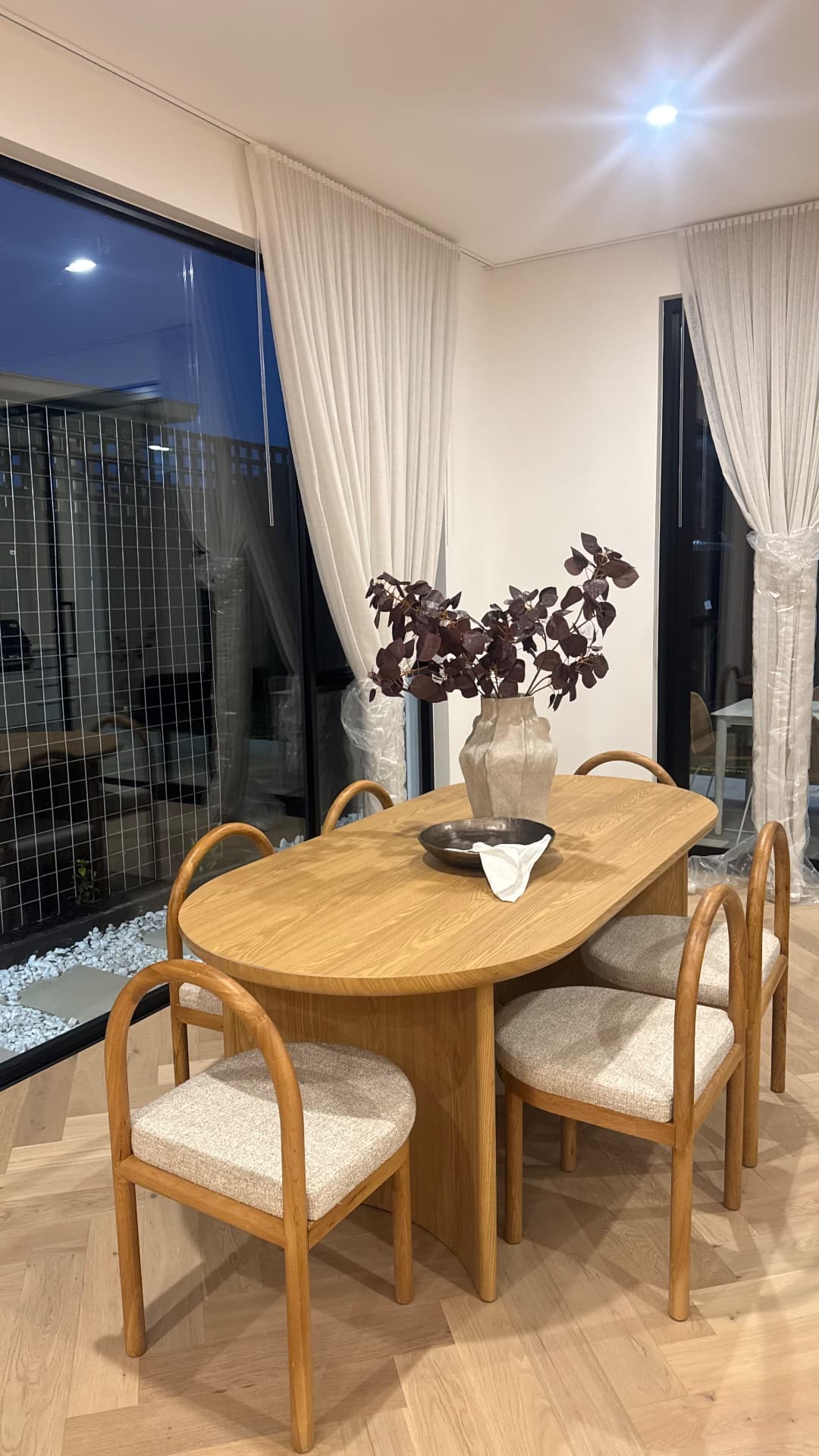 Dining area with sealed window frames and timber floor edges