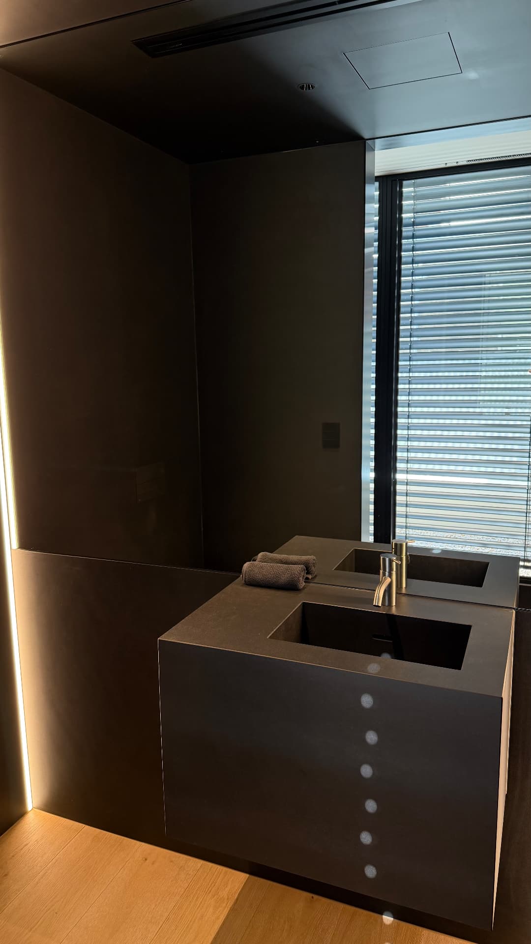 Powder room vanity with sealed stone benchtop and basin